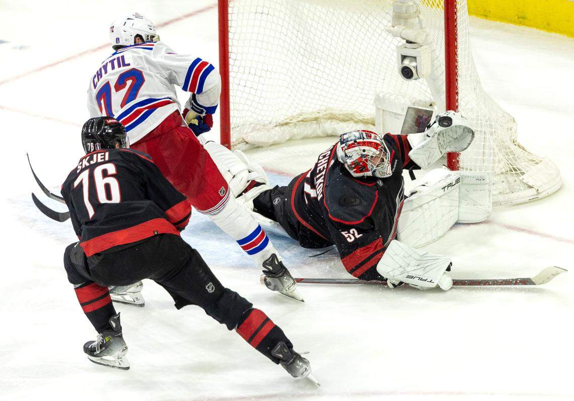 Carolina Hurricanes goaltender Pyotr Kochetkov (52) stops a scoring attempt by New York Rangers center Fillip Chytil (72) in the third period of Game 3 in the second round of the 2024 Stanley Cup playoffs on Thursday, May 9, 2024 at PNC Arena, in Raleigh N.C.