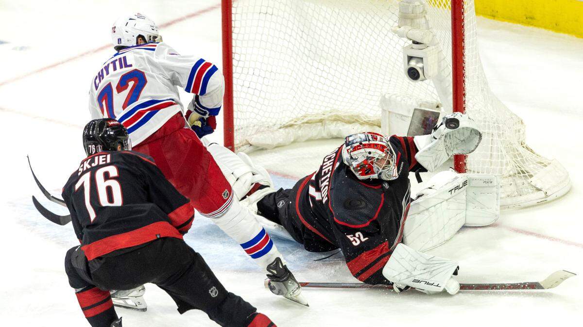 Carolina Hurricanes goaltender Pyotr Kochetkov (52) stops a scoring attempt by New York Rangers center Fillip Chytil (72) in the third period of Game 3 in the second round of the 2024 Stanley Cup playoffs on Thursday, May 9, 2024 at PNC Arena, in Raleigh N.C.