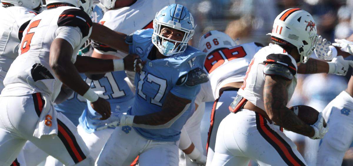 North Carolina linebacker Amare Campbell (17) works to stop Campbells’ Chris McKay Jr. (11) on Saturday, November 4. 2023 at Kenan Stadium in Chapel Hill, N.C.