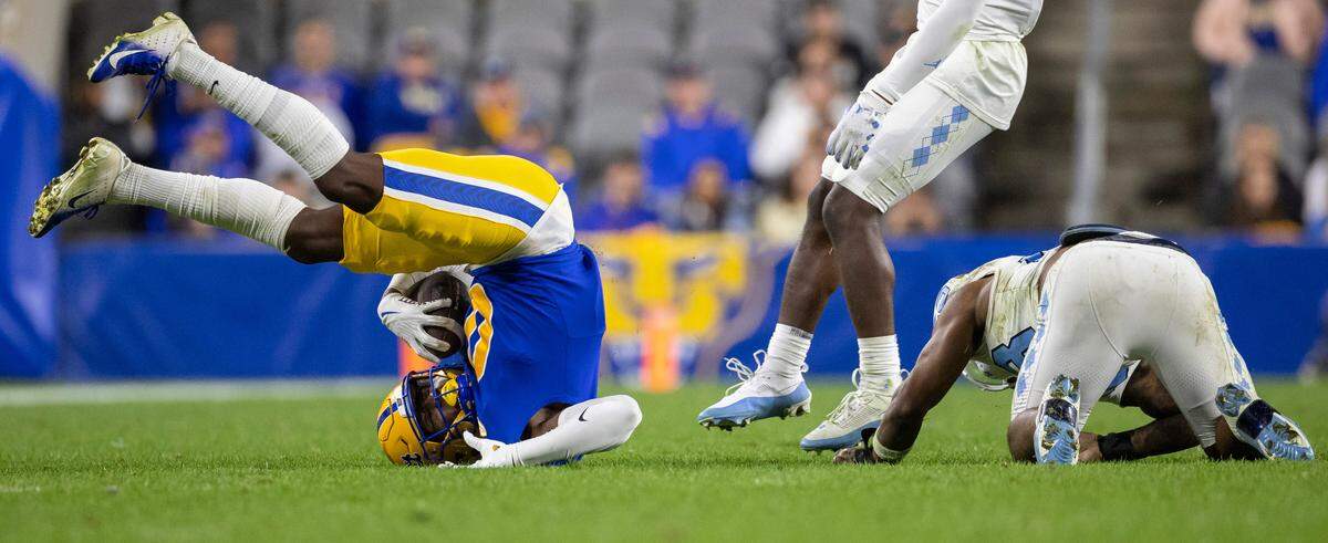 North Carolina’s Power Echols (23) stops Pitt’s Bub Means (0) after a four yard pass reception from quarterback Christian Veilleux in the fourth quarter on Saturday, September 23, 2023 at Acrisure Stadium in Pittsburgh, Pa.