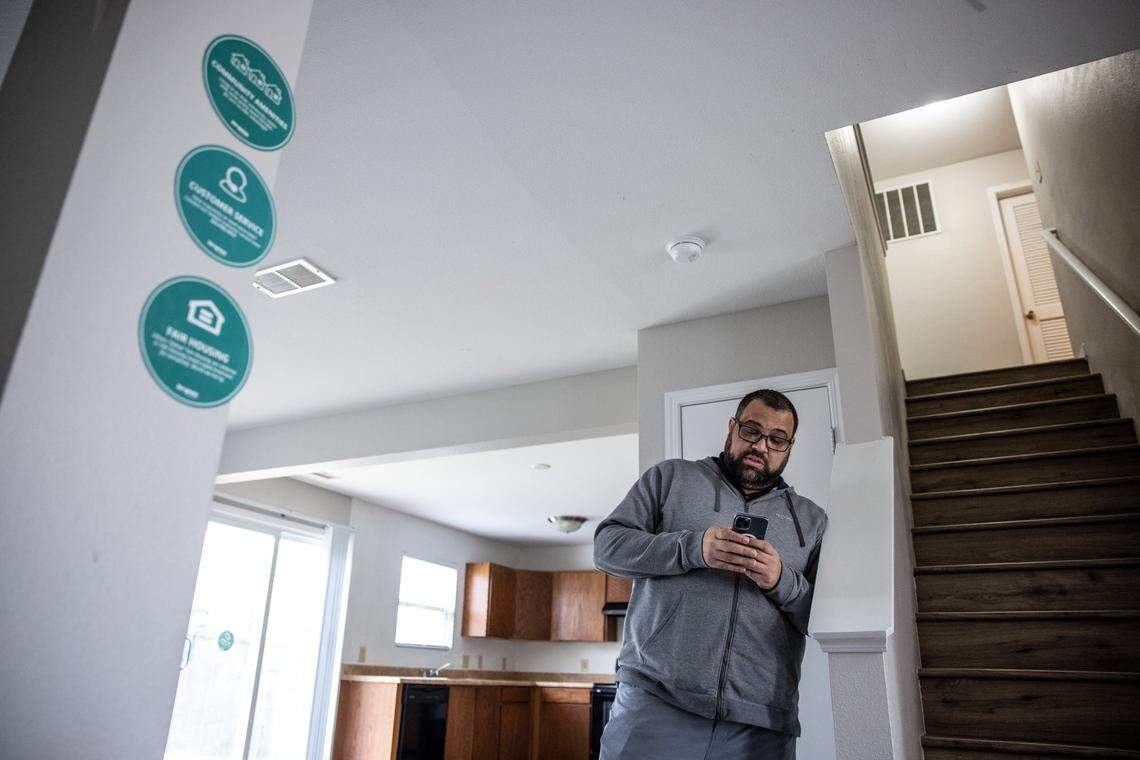 Jonathan Osman, a longtime Charlotte Realtor, looks up information about a home in northwest Charlotte that’s owned by Progress Residential. Signs on the walls tell prospective tenants how to apply, a phone number to call with questions and even a “make you feel at home” playlist for your tour.