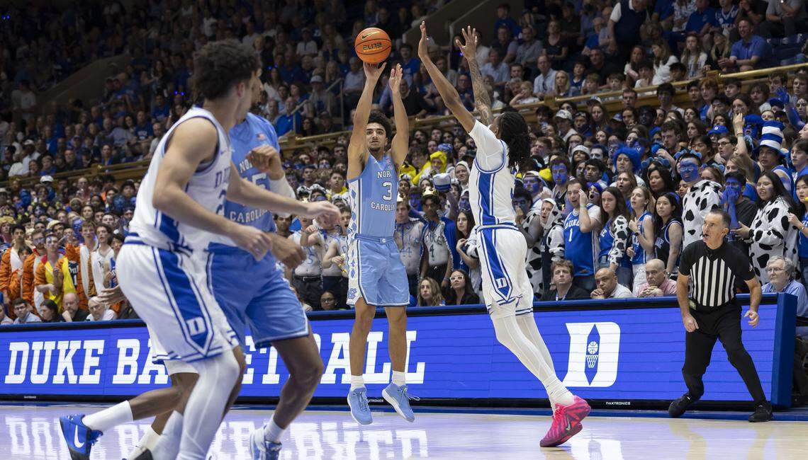 North Carolina guard Derek Dixon (3) launches a three-point shot against Duke forward Isaiah Evans (3) in the second half on Saturday, March 7, 2026 at Cameron Indoor Stadium in Durham, N.C.  Dixon lead North Carolina 17 points in their loss to the Blue Devils. 