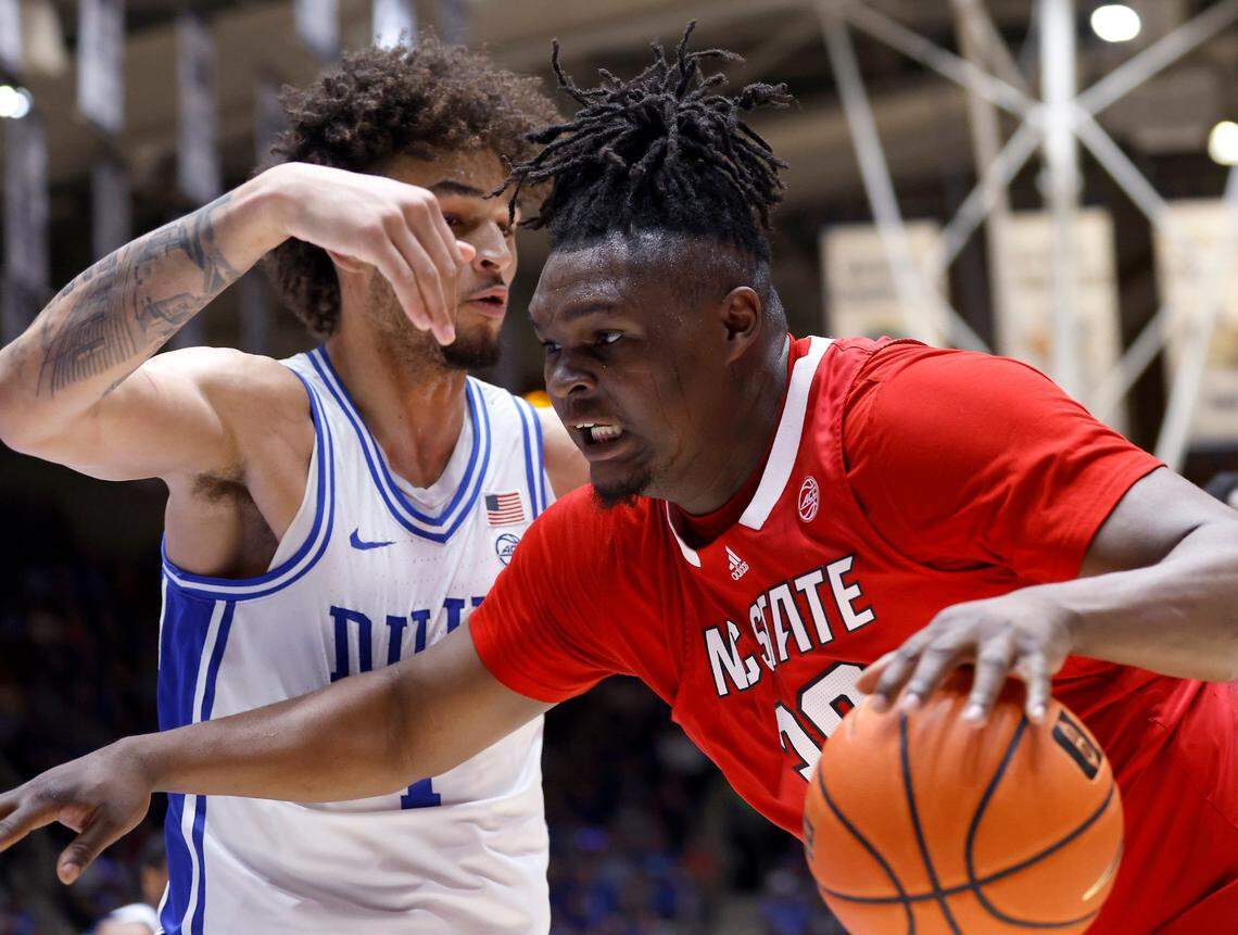 North Carolina State’s D.J. Burns Jr. drives past Duke’s Dereck Lively II during the first half of Duke’s final regular-season home game against N.C. State on Tuesday, Feb. 28, 2023, at Cameron Indoor Stadium in Durham, N.C.