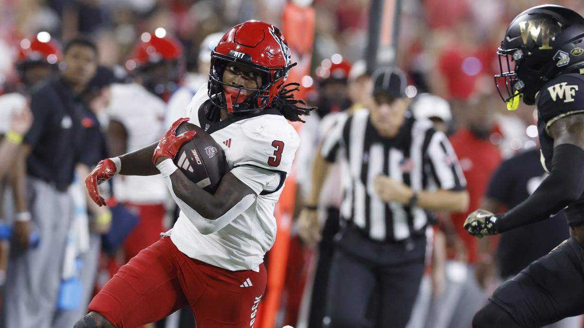 N.C. State running back Hollywood Smothers (3) gains yards during the first half of N.C. State’s game against Wake Forest at Allegacy Stadium in Winston-Salem, N.C., Thursday, Sept. 11, 2025.