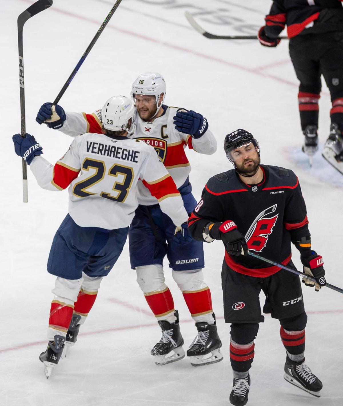 Carolina Hurricanes left wing William Carrier (28) reacts as Florida Panthers center Carter Verhaeghe (23) celebrates his game winning goal in the third period, clinching their Stanley Cup series with a 5-3 victory on Wednesday, May 28, 2025 at Lenovo Center in Raleigh, N.C.