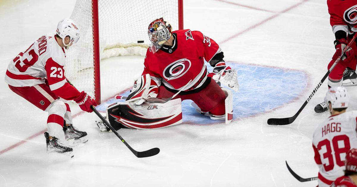 Detroit’s Robert Hagg (38) scores on Carolina Hurricanes’ goalie Antii Raanta (32) in the second period on Tuesday, April 11, 2023 at PNC Arena in Raleigh, N.C.