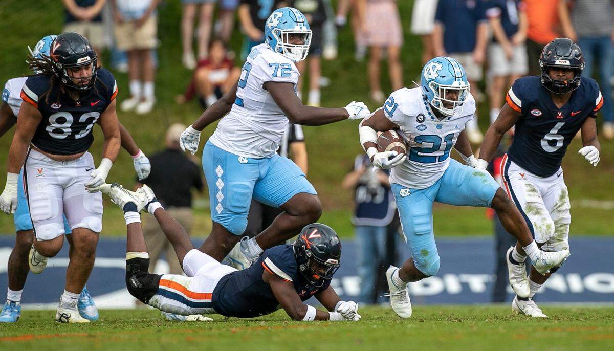 North Carolina’s Elijah Green (21) breaks open on a14-yard gain in the second quarter against Virginia on Saturday, November 5, 2022 at Scott Stadium in Charlottesville, Va.