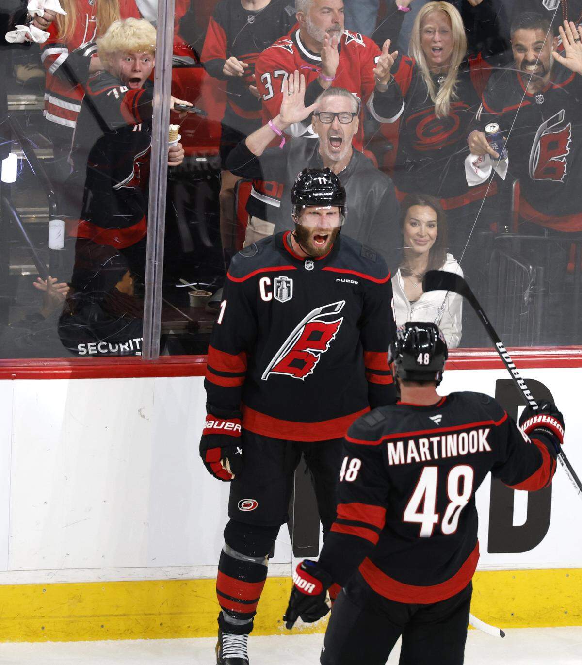 Carolina's Jordan Martinook (48) celebrates with  Jordan Staal (11) after Staal scored in the second period of the Hurricanes’ game against the Golden Knights in the first game of the Stanley Cup Final at the Lenovo Center in Raleigh, N.C., Tuesday, June 2, 2026.