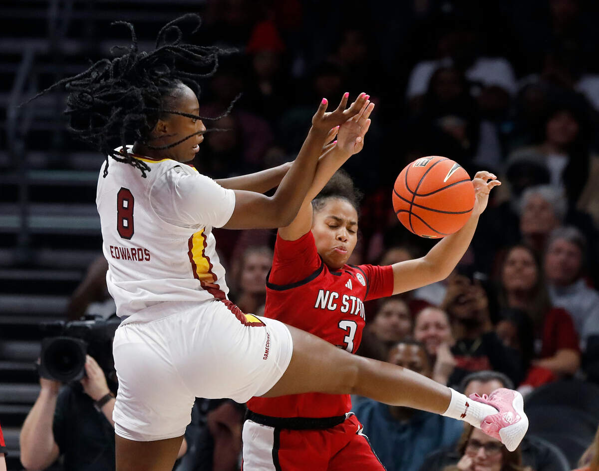 South Carolina’s Joyce Edwards and N.C. State’s Zamareya Jones scramble for a loose ball during the first half of the Wolfpack’s game on Sunday, Nov. 10, 2024, at Spectrum Center in Charlotte, N.C.