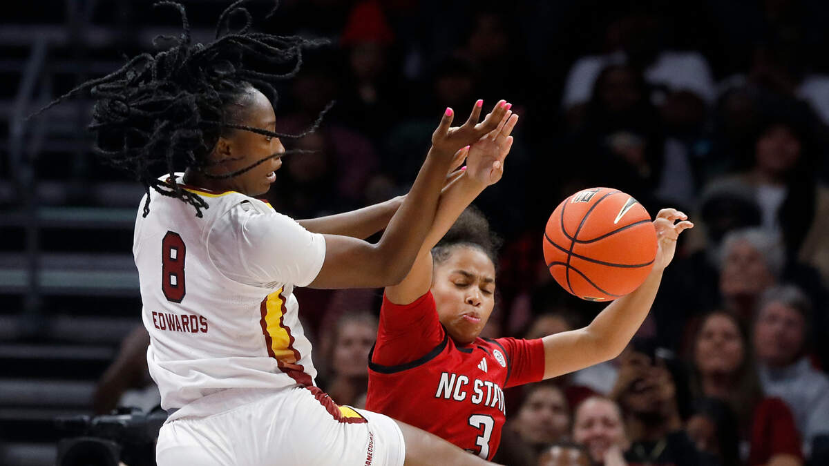 South Carolina’s Joyce Edwards and N.C. State’s Zamareya Jones scramble for a loose ball during the first half of the Wolfpack’s game on Sunday, Nov. 10, 2024, at Spectrum Center in Charlotte, N.C.