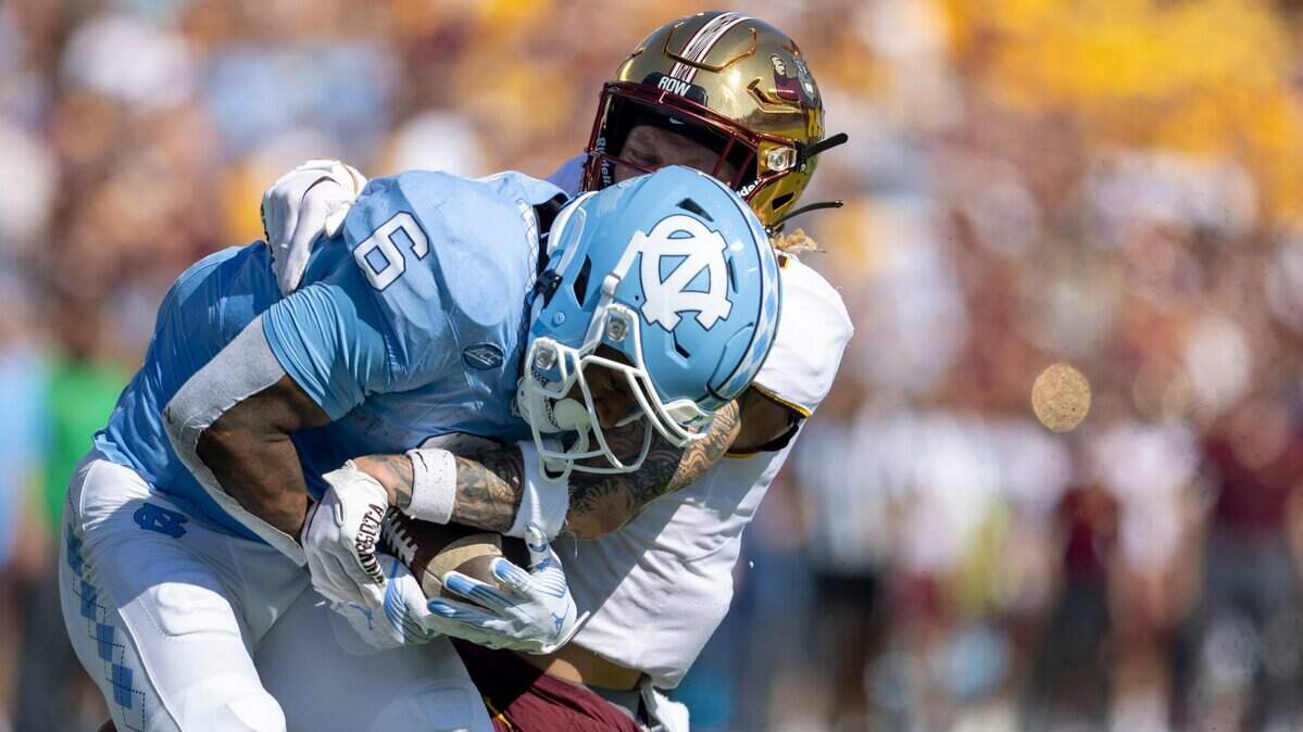 North Carolina’s Nate McCollum (6) scores in a 46-yard pass reception from quarterback Drake Maye in the first quarter against Minnesota on Saturday, September 16, 2023 at Kenan Stadium in Chapel Hill N.C.