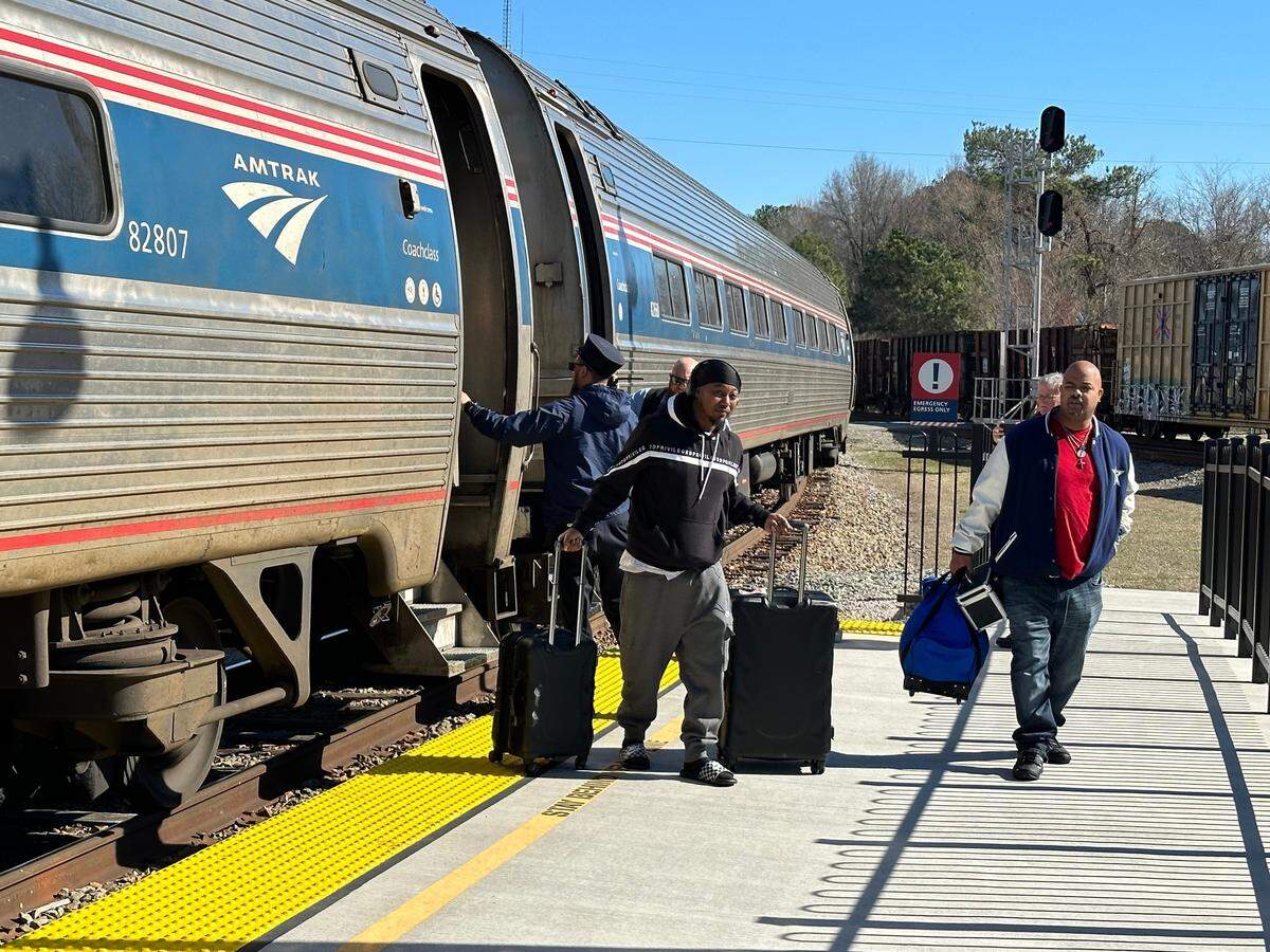 Passengers disembark from Amtrak’s Carolinian on the new platform at Selma-Smithfield Union Depot on Wednesday, Feb. 14, 2024.