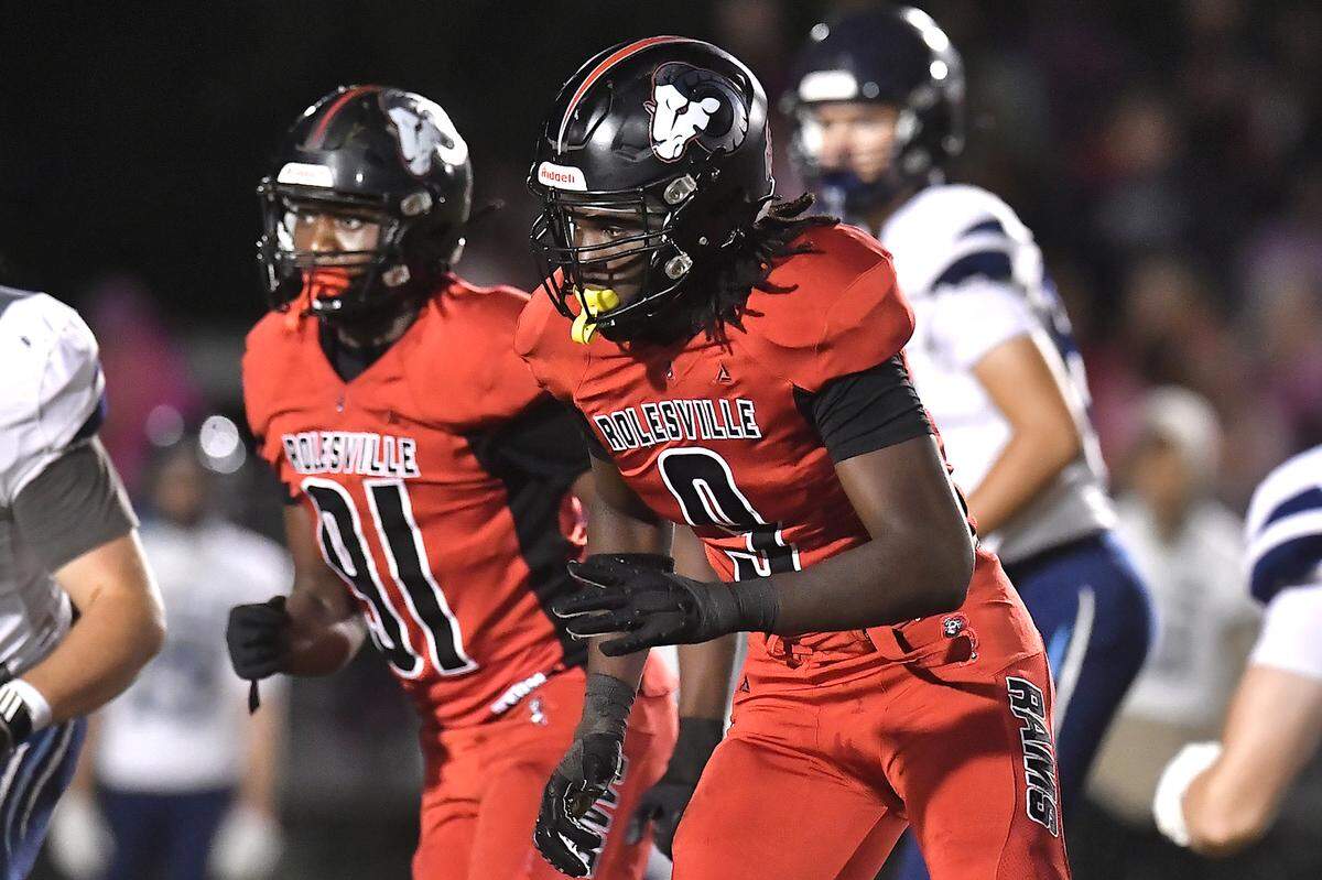 Rolesville defensive end Zavion Griffin-Haynes (9) defends against Millbrook during the first half. The Rolesville Rams and the Millbrook Wildcats met in a football game in Raleigh. N.C. on October 11, 2024.