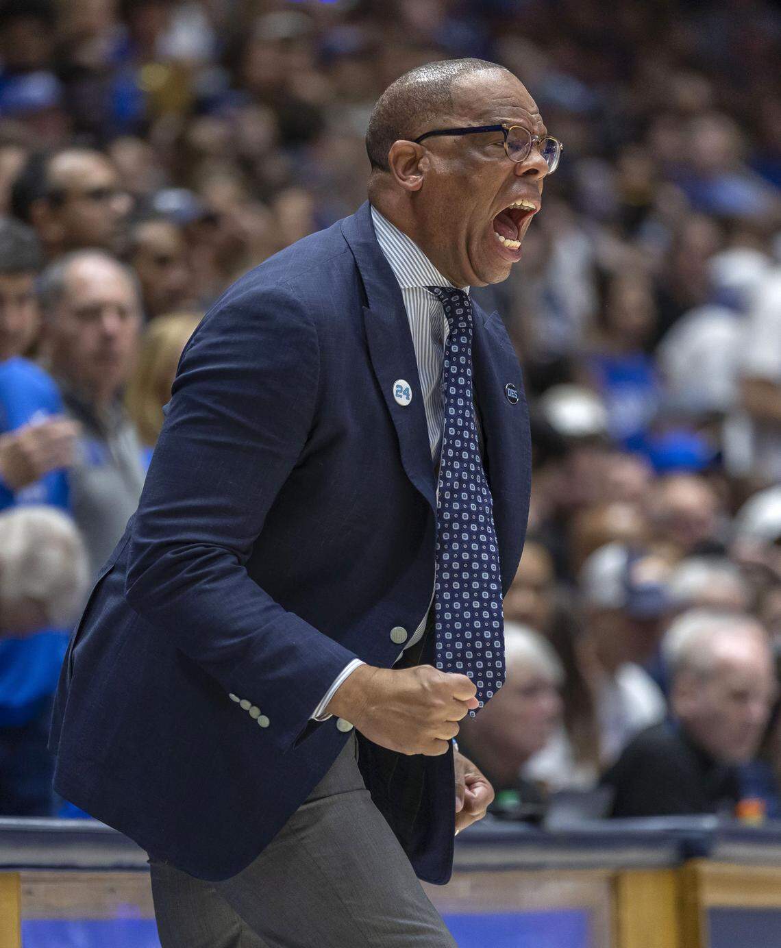 North Carolina coach Hubert Davis yells as his team on defense in the first half against Duke on Saturday, March 7, 2026 at Cameron Indoor Stadium in Durham, N.C.