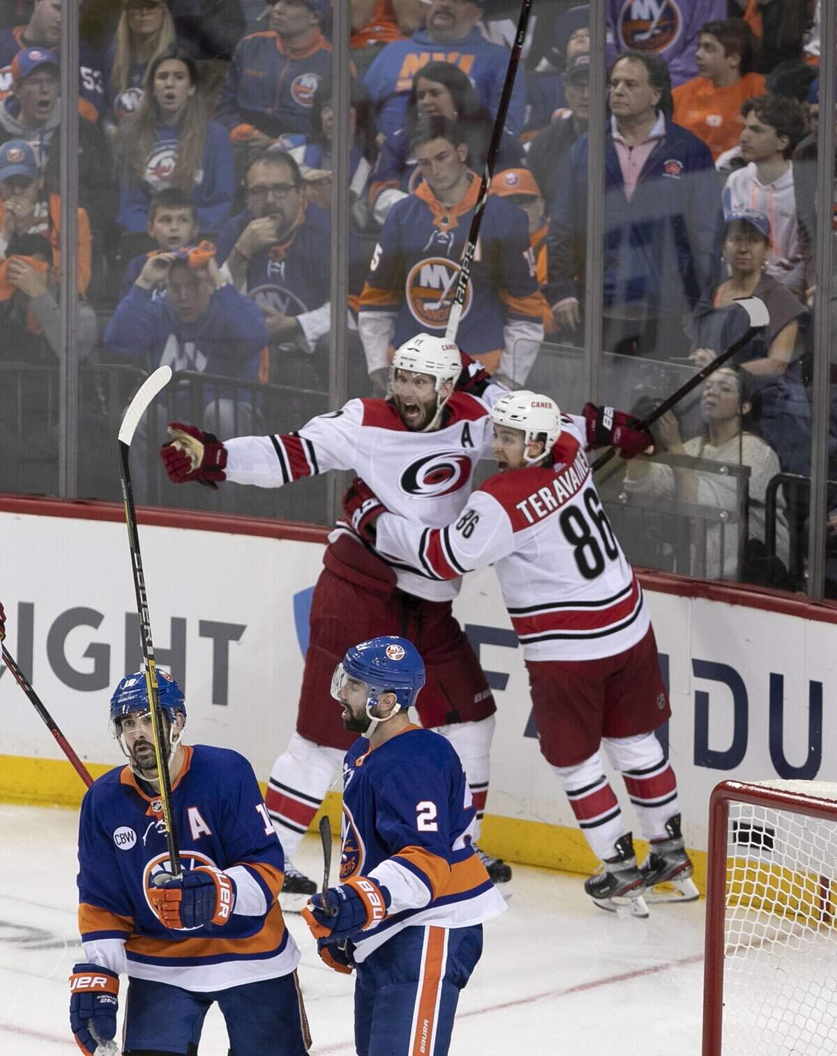 Carolina Hurricanes’ Jordan Staal (11) celebrates with Teuvo Teravainen (86) and Nino Niederreiter (21) as they celebrate their 1-0 overtime victory over the New York Islanders in Game 1 of the second round Stanley Cup series on Friday, April 26, 2019 at Barclays Center in Brooklyn, N.Y.