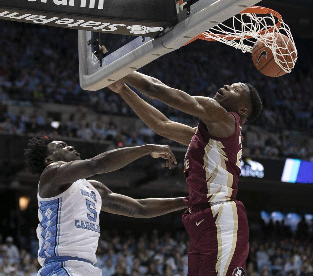 North Carolina’s Nassir Little (5) dunks on Florida State’s Mfiondu Kabegnele (25) during the first half on Saturday, February 23, 2019 at the Smith Center in Chapel Hill, N.C