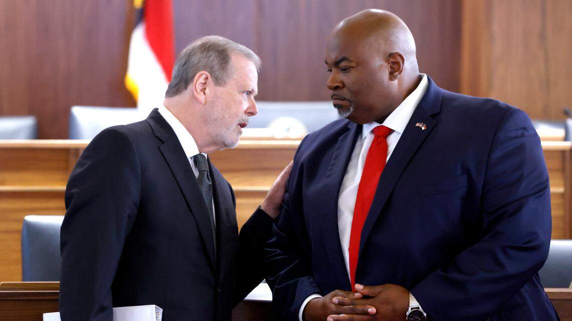 Senate Leader Phil Berger, left, talks with Lt. Gov. Mark Robinson during a press conference in this 2021 file photo.
