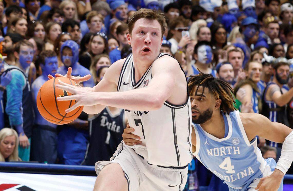 Duke’s Kon Knueppel (7) drives past North Carolina’s RJ Davis (4) during the second half of Duke’s 87-70 victory over UNC at Cameron Indoor Stadium in Durham, N.C., Saturday, Feb. 1, 2025.