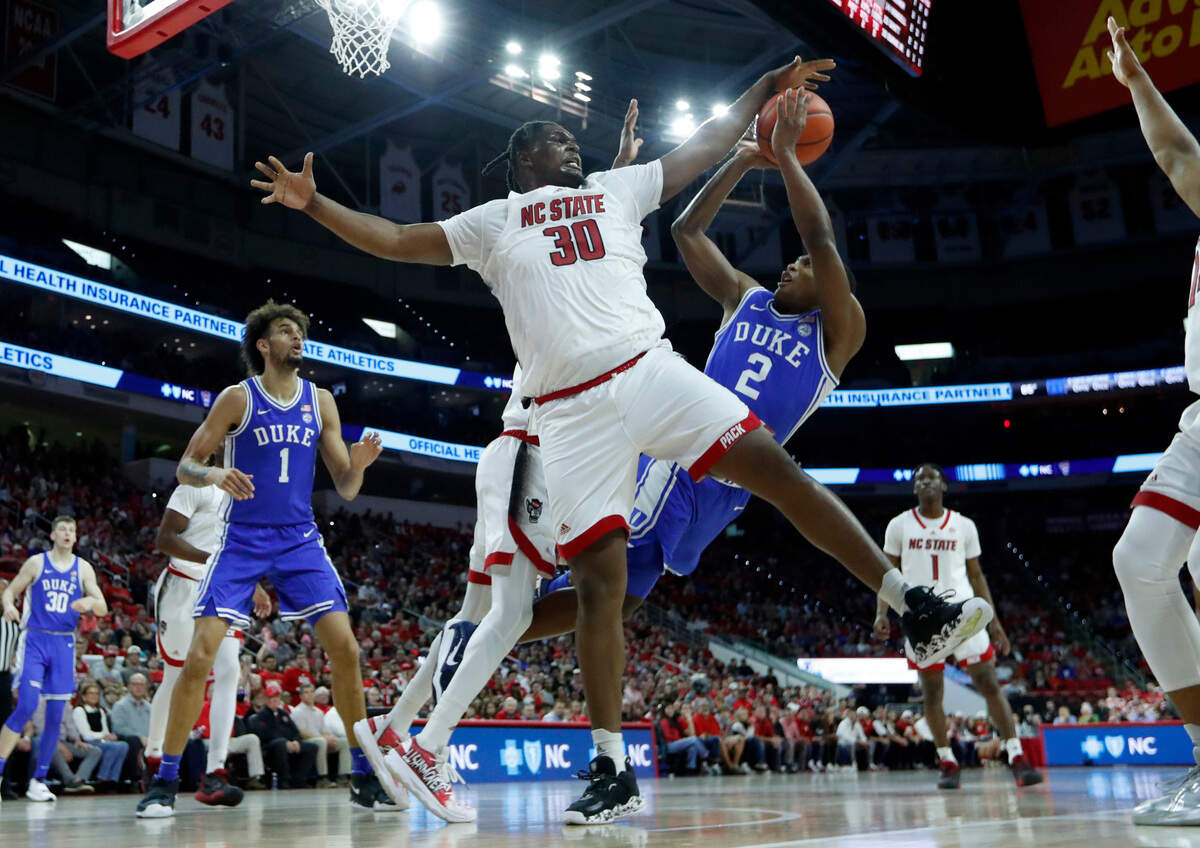 N.C. State’s D.J. Burns Jr. (30) blocks the shot by Duke’s Jaylen Blakes (2) during N.C. State’s 84-60 victory over Duke at PNC Arena in Raleigh, N.C., Wednesday, Jan. 4, 2023.