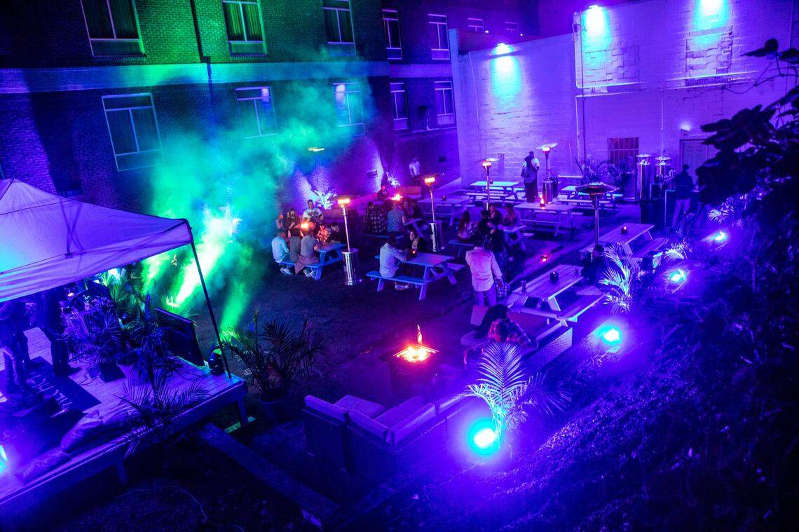 Patrons party in an outdoor area at Alchemy in the Glenwood South bar and restaurant district in Raleigh Wednesday night, Nov. 25, 2020.