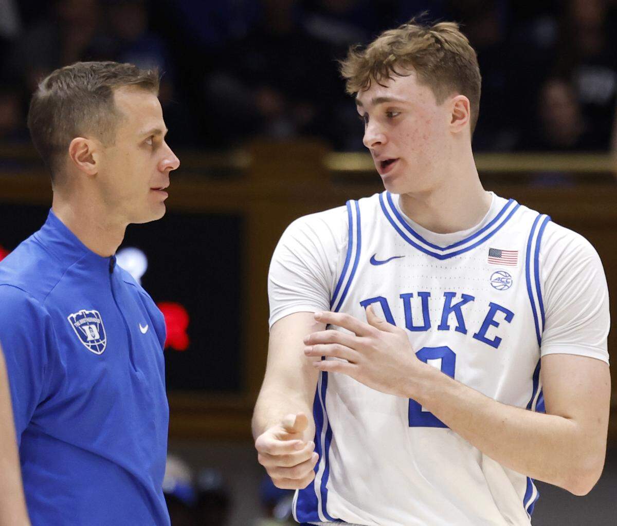 Duke head coach Jon Scheyer talks with Cooper Flagg (2) during the first half of Duke’s game against Stanford at Cameron Indoor Stadium in Durham, N.C., Saturday, Feb. 15, 2025.