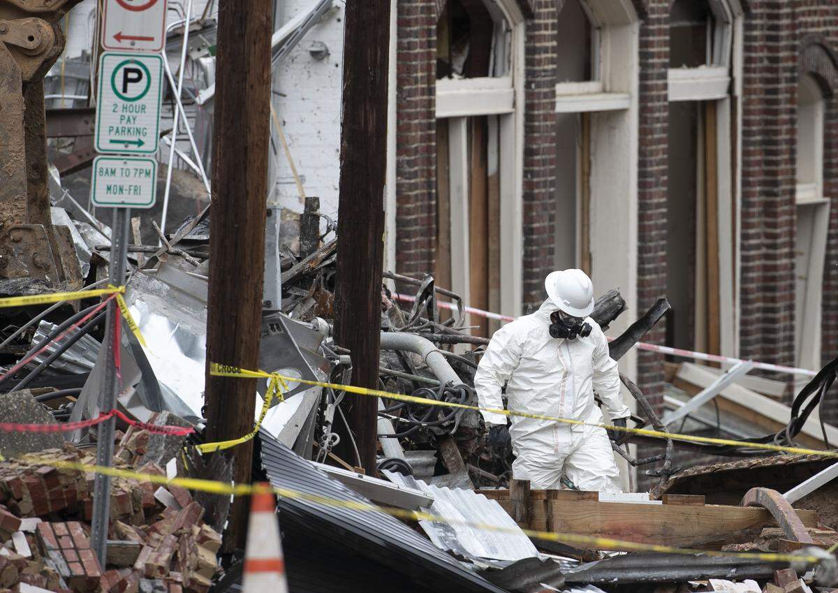 Members of the SBI and other investigators comb through the rubble of the Kaffeinate Coffee shop on North Duke Street on Friday, April 12, 2019 in Durham, N.C. looking for clues as they investigate the gas explosion that killed two people and injured 25 others on April 10.