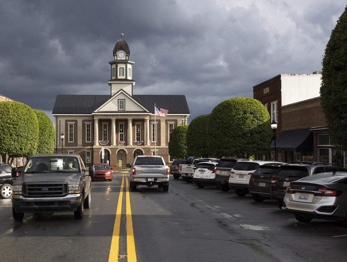 The historic Chatham County Courthouse is all decked out with bunting for the July 4th holiday. Hillsboro Street is aglow after a brief thunderstorm on Thursday July 10, 2025 in Pittsboro, N.C. 