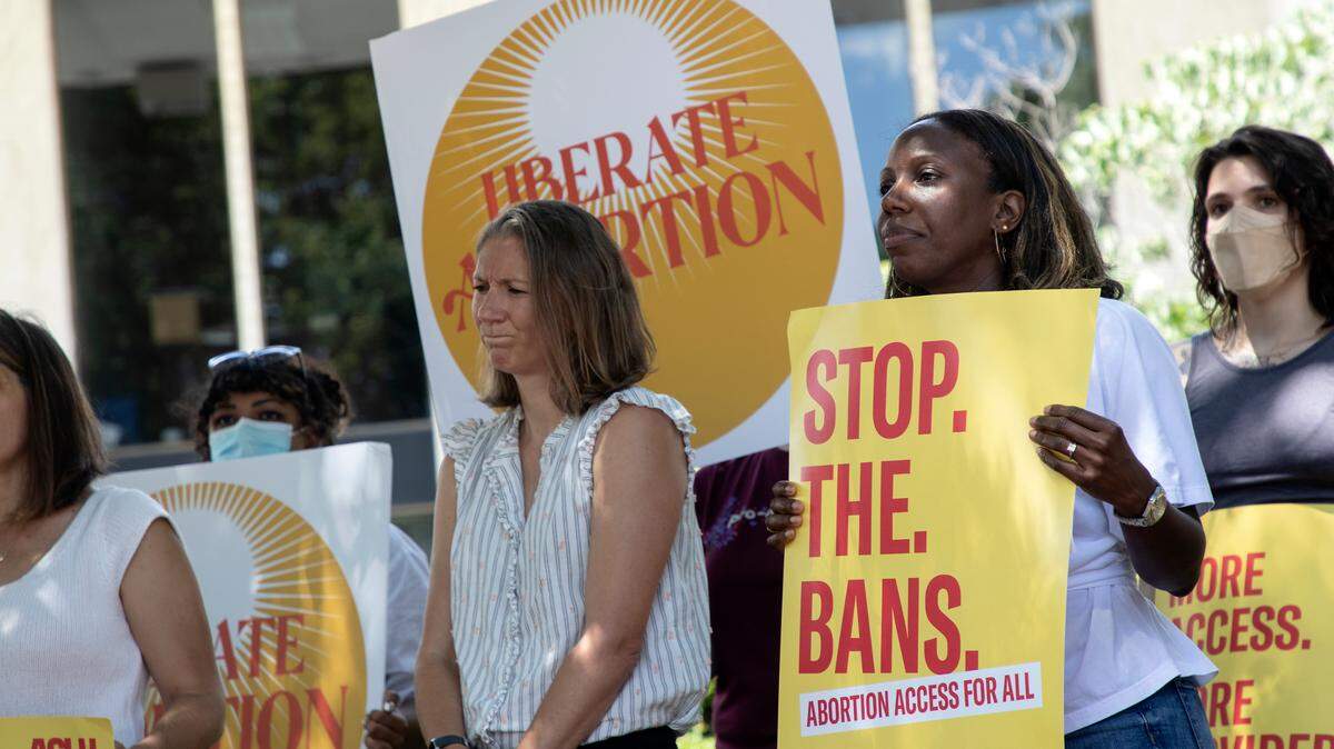 The US Supreme Court’s decision to overturn Roe v. Wade resulted in a surge in women registering to vote in many states, including North Carolina. In this June 24, 2022 photo women in Raleigh hold signs protesting the court’s decision.