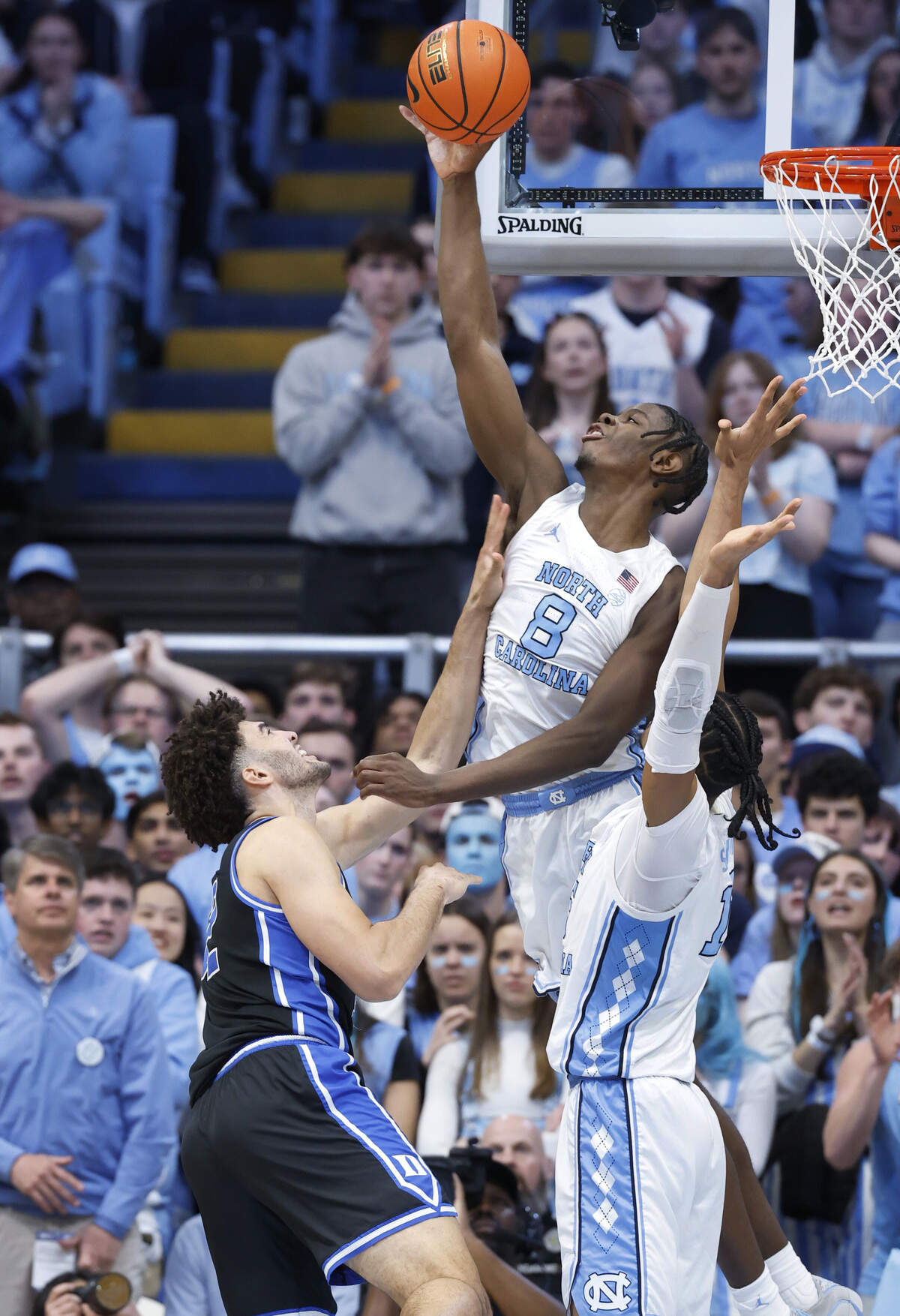 North Carolina's Caleb Wilson (8) blocks the shot by Duke’s Cameron Boozer (12) during the first half of Duke’s game against UNC at the Dean E. Smith Center in Chapel Hill, N.C., Saturday, Feb. 7, 2026.
