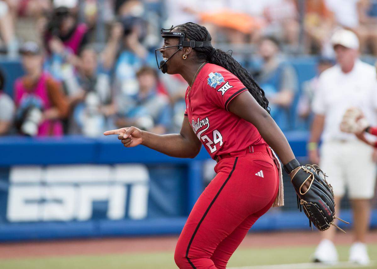 Texas Tech Red Raiders pitcher NiJaree Canady (24) points to her catcher after a strikeout in the first inning against the Texas Longhorns during game three of the NCAA Softball Women's College World Series finals at Devon Park. 