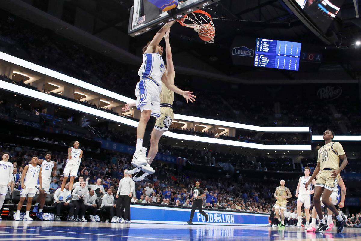 Duke’s Isaiah Evans (3), left, celebrates as Tyrese Proctor (5) slams in two during Duke’s victory over Georgia Tech in the quarterfinals of the 2025 ACC Men’s Basketball Tournament at the Spectrum Center in Charlotte, N.C., Thursday, March 13, 2025.