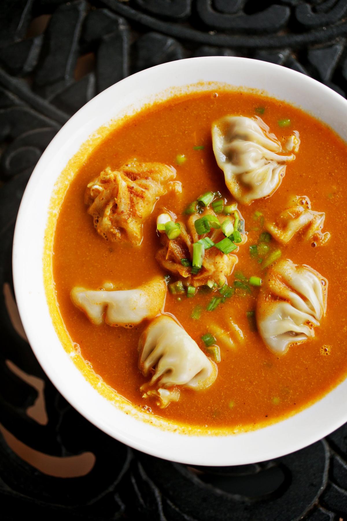 Momo are Tibetan/Nepalese filled dumplings similar to a Chinese wonton, but with a more substantial wrapper that has a gratifyingly chewy-tender bite. EverestNepali Kitchen offers several versions, each available with your choice of vegetable, chicken or lamb filling.