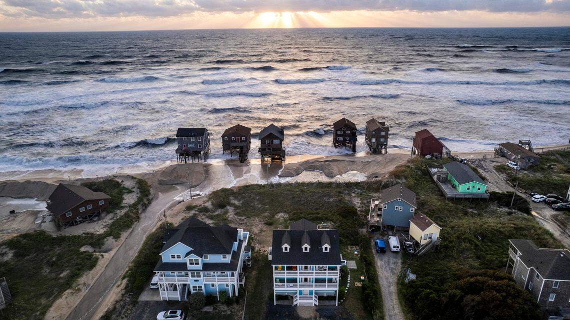 Surf edges towards homes in Rodanthe Friday, Sept, 15, 2023 as Hurricane Lee churns in the Atlantic hundreds of miles offshore.
