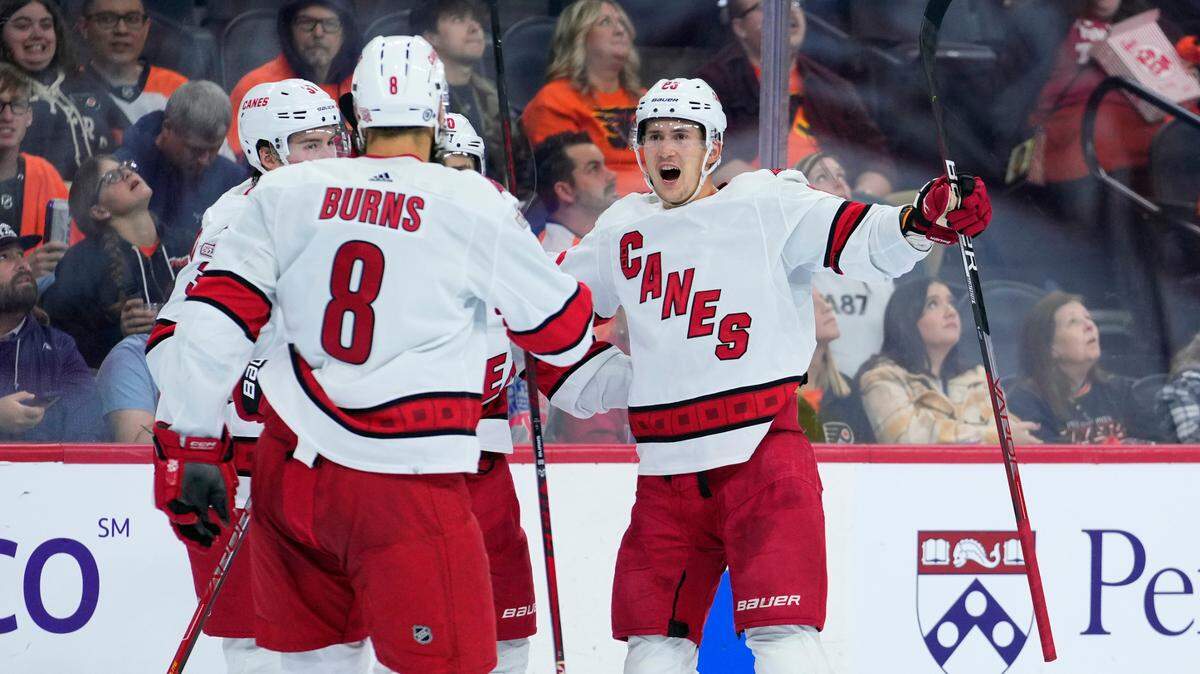 Carolina Hurricanes’ Martin Necas, right, celebrates with teammates after scoring a goal during the third period of an NHL hockey game against the Philadelphia Flyers, Saturday, Oct. 29, 2022, in Philadelphia. (AP Photo/Matt Slocum)