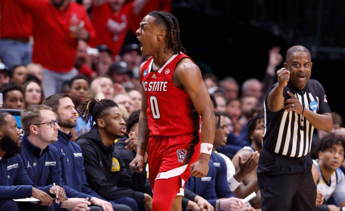 N.C. State’s DJ Horne (0) celebrates making a three-pointer while being fouled during the first half of N.C. State’s game against Marquette in their NCAA Tournament Sweet 16 game at the American Airlines Center in Dallas, Texas, Friday, March 29, 2024.