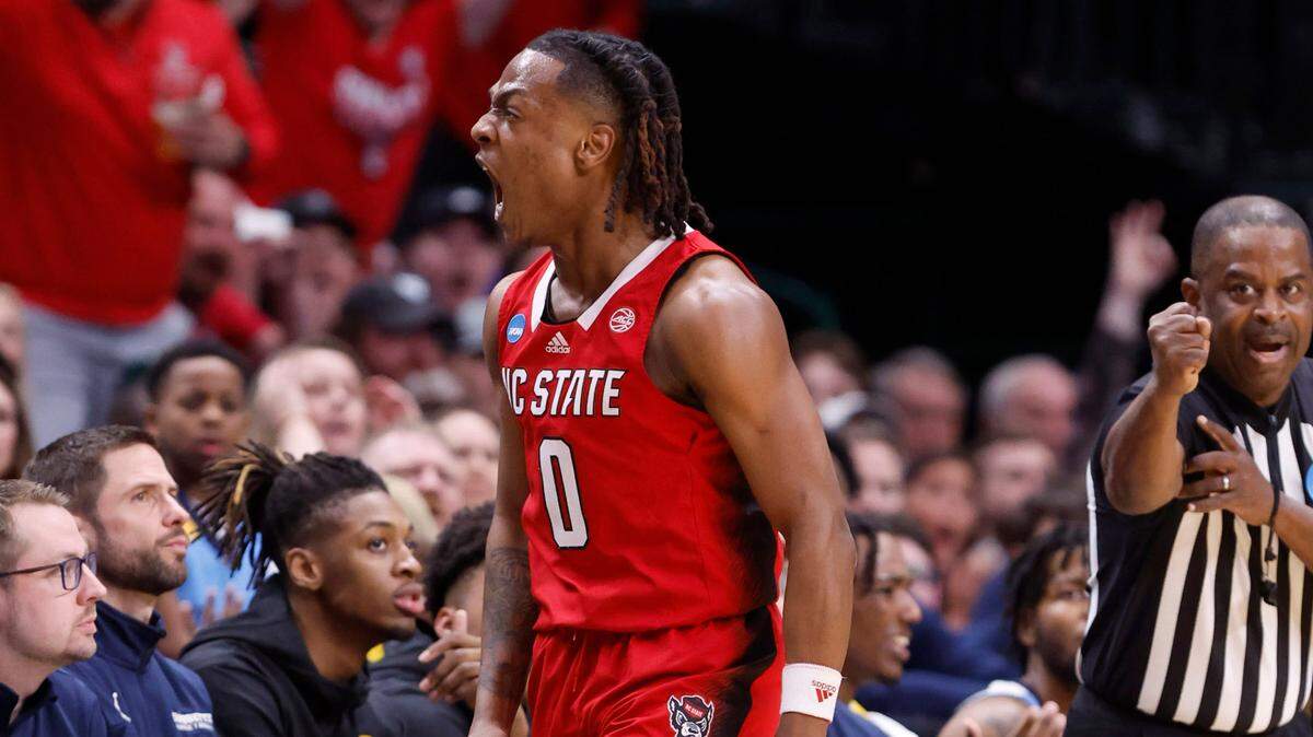 N.C. State’s DJ Horne (0) celebrates making a three-pointer while being fouled during the first half of N.C. State’s game against Marquette in their NCAA Tournament Sweet 16 game at the American Airlines Center in Dallas, Texas, Friday, March 29, 2024.