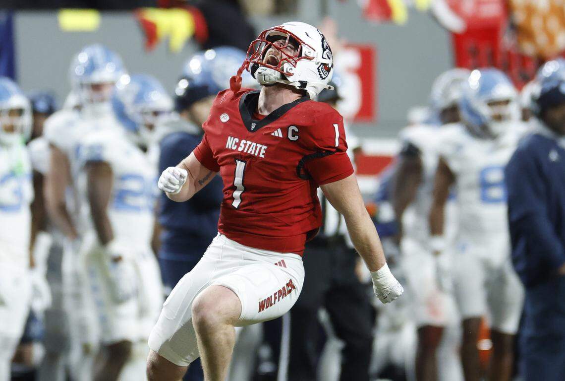 N.C. State linebacker Caden Fordham (1) celebrates after sacking North Carolina quarterback Gio Lopez during the first half of N.C. State’s game against UNC at Carter-Finley Stadium in Raleigh, N.C., Saturday, Nov. 29, 2025.