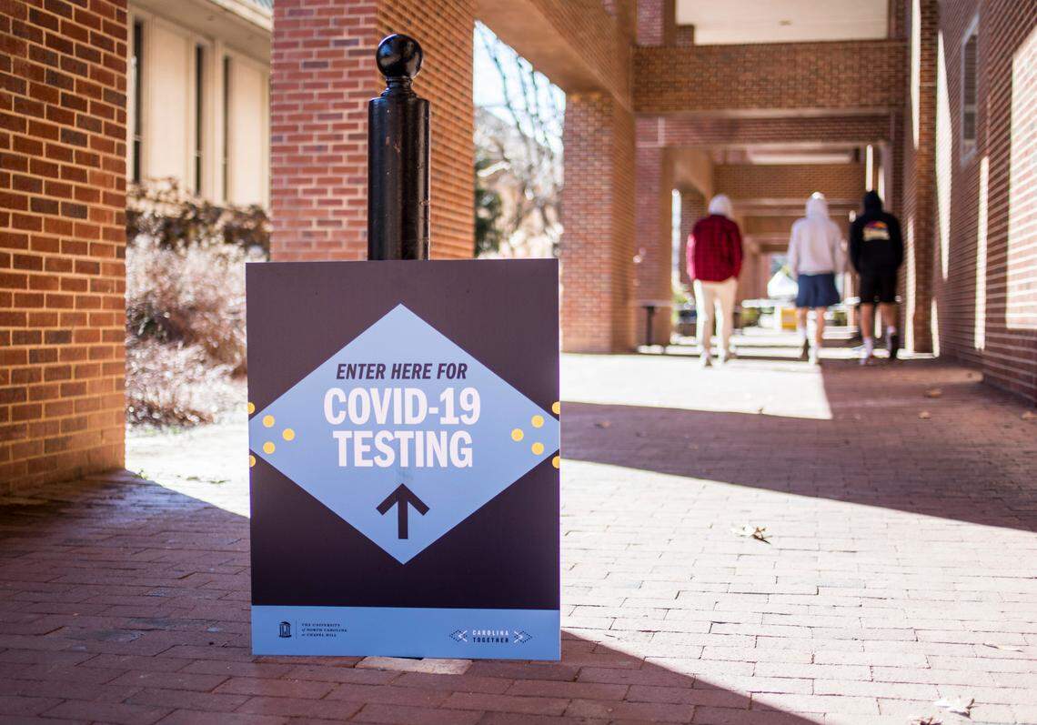 A sign outside Davis Library directs UNC-Chapel Hill students towards a COVID-19 testing site on the Chapel Hill, N.C. campus, pictured here on Wednesday, Feb. 3, 2021.