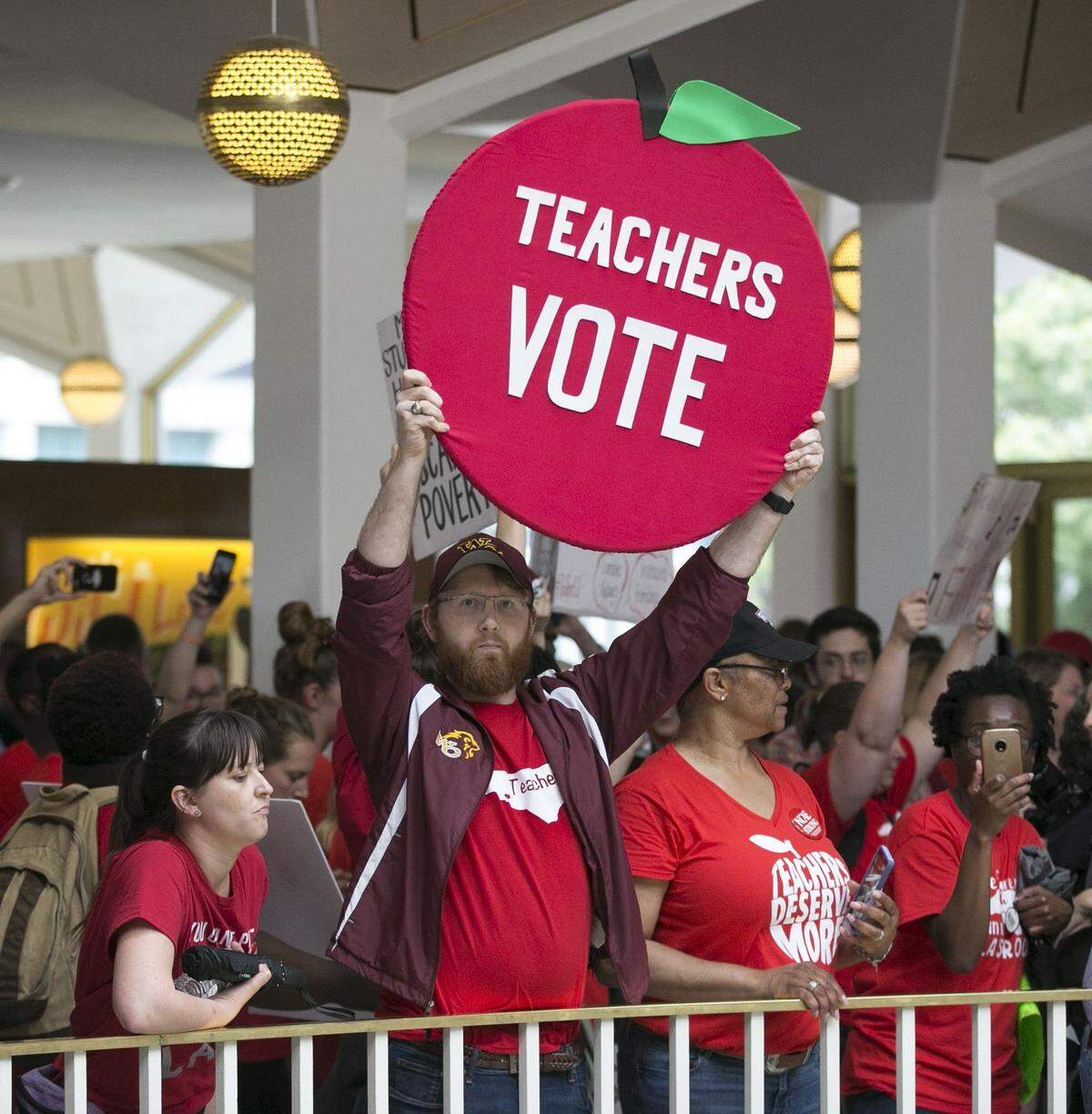 Kevin Poirier from West Charlotte High School, and fellow educators, fill the rotunda of the Legislature as they try to disrupt the House and the Senate as they gavel in their sessions on Wednesday, May 16, 2018 in Raleigh, N.C.