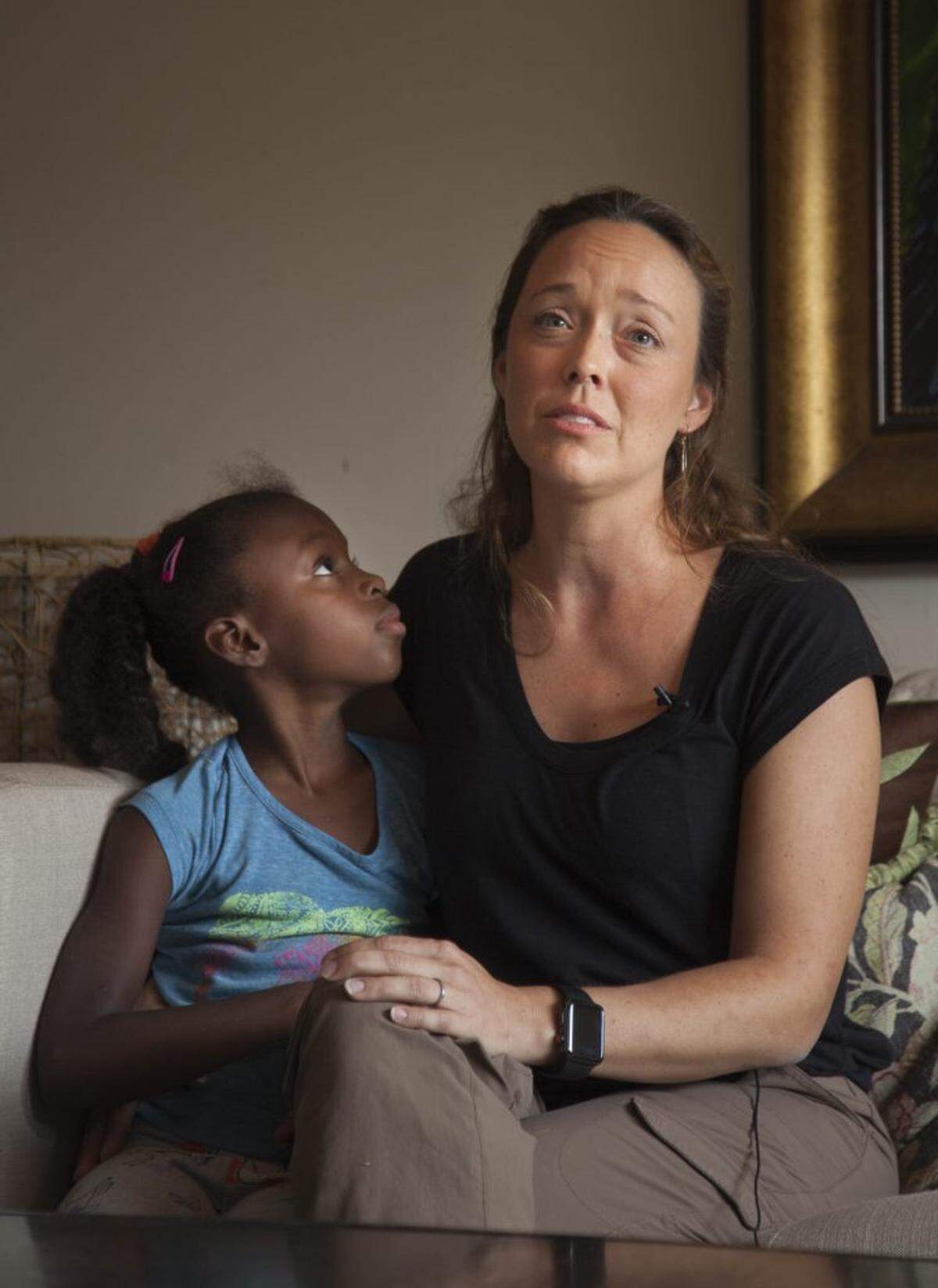 Misty Hedspeth and one of her daughters on the couch as she talks about how God has grown their family.