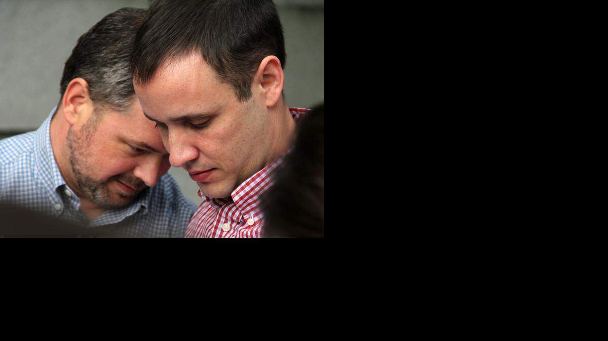 Channing Richards and Brandon Hagar of Hillsborough were among the first gay and lesbian couples to receive licenses and be legally married Monday, Oct. 13, 2014, at the Durham County Register of Deeds office in the old courthouse building on East Main Street. The couple has been together since 2006.
