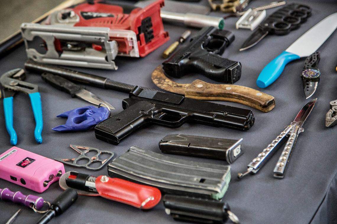 The Transportation Security Administration displays a few of the items TSA screeners found in carry-on luggage at Raleigh-Durham International Airport, in a file photo from 2023.