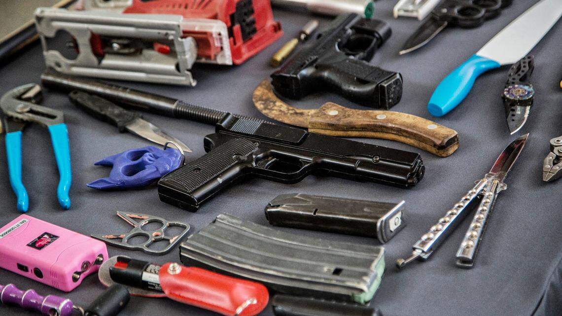 The Transportation Security Administration displays a few of the items TSA screeners found in carry-on luggage at Raleigh-Durham International Airport, in a file photo from 2023.