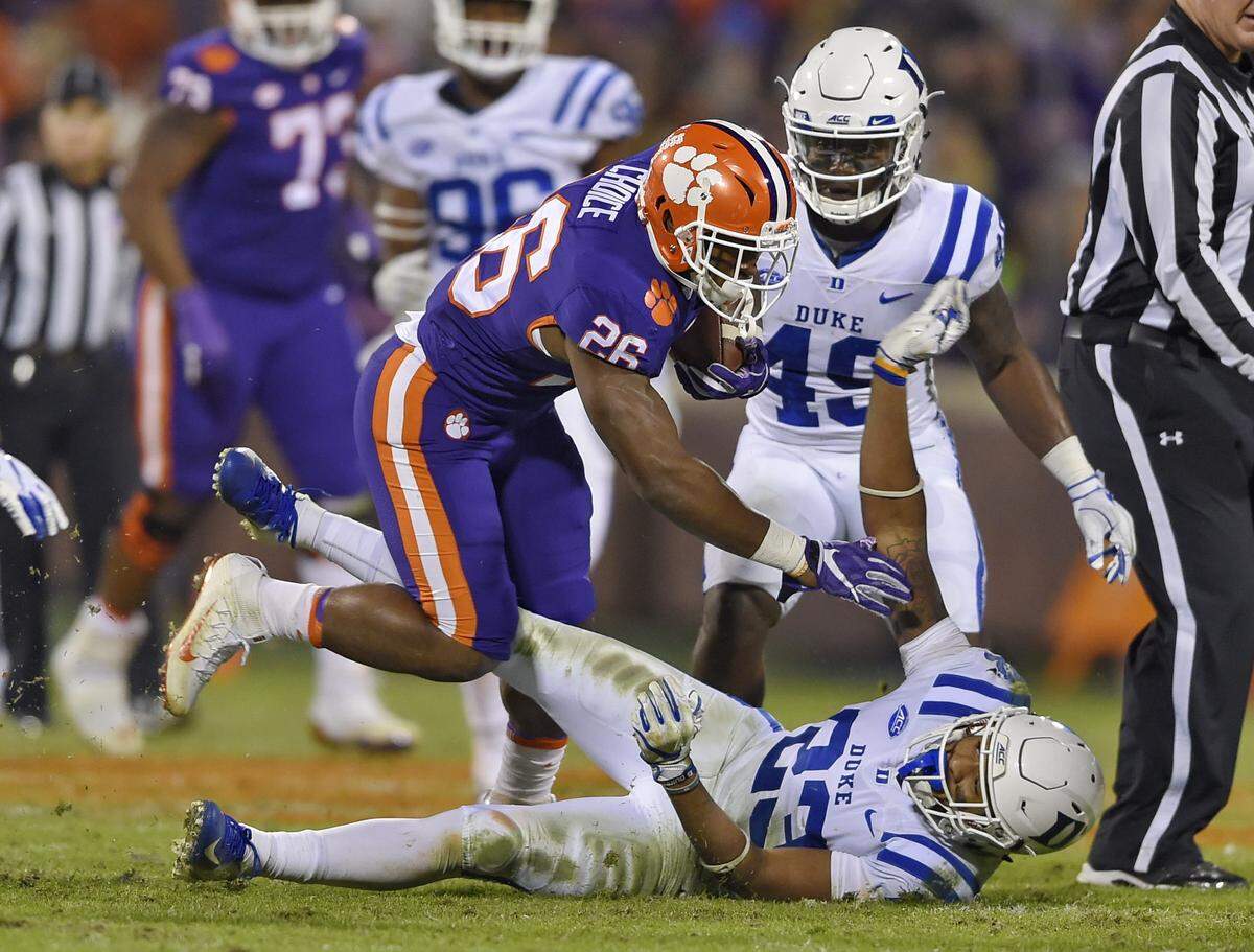Clemson’s Adam Choice plows through Duke’s Lummie Young lV to gain a first down during the second half Saturday, Nov. 17, 2018, in Clemson, S.C. Clemson won 35-6. 
