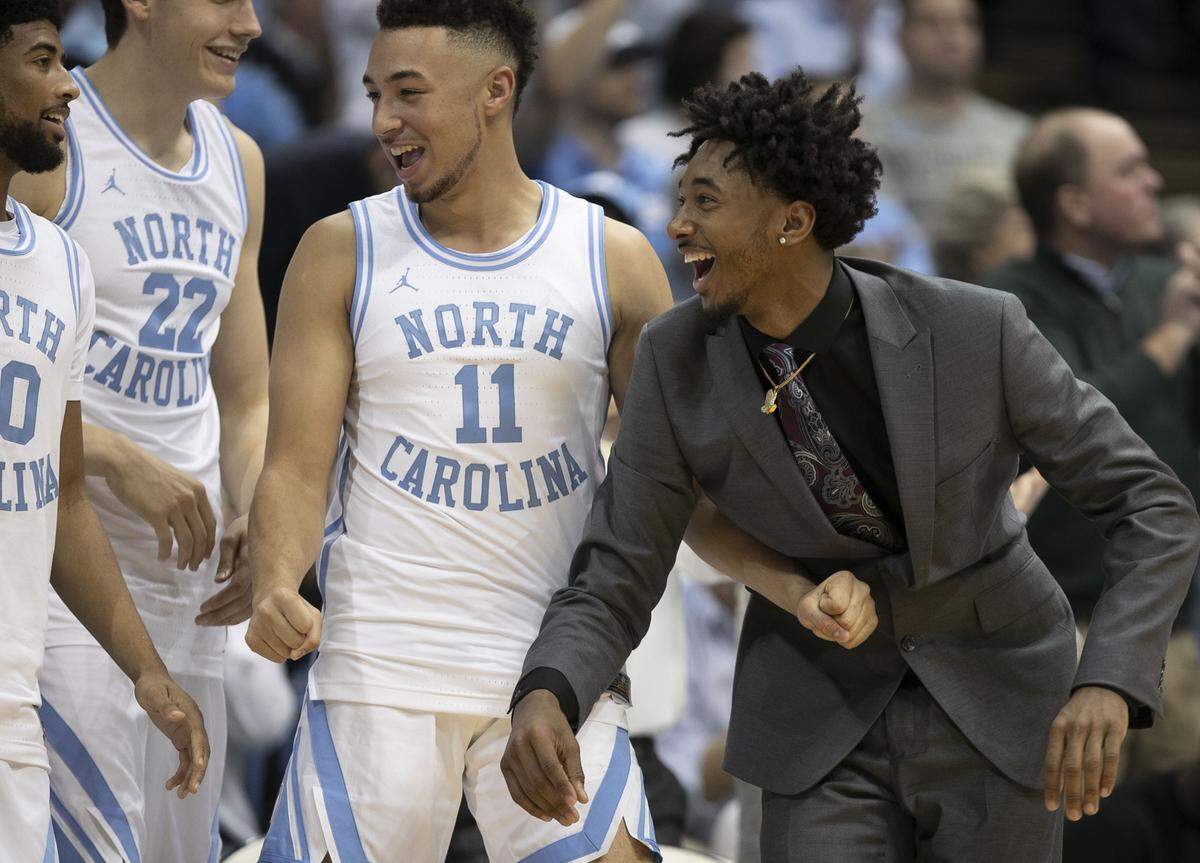 North Carolina’s Leaky Black, out with an injury, relishes in a three point lead over Virginia in the second half on Monday, February 11, 2019 at the Smith Center in Chapel Hill, N.C.