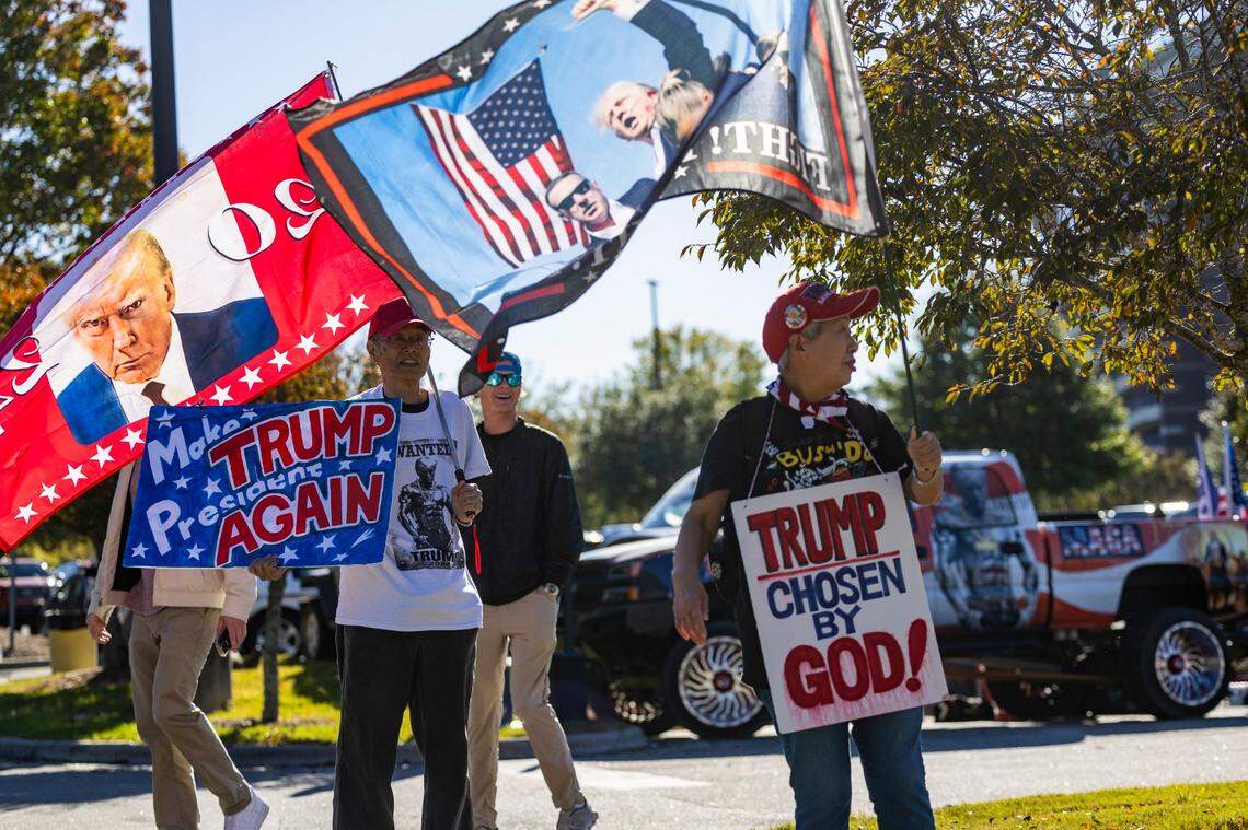 Supporters of former President Donald Trump gather outside Minges Coliseum in Greenville prior to a rally on Monday, Oct. 21, 2024. With two weeks until Election Day, Trump went on a three-city tour, in which Trump will also see the destruction caused by Hurricane Helene in Asheville and speak at a faith conference in Concord.