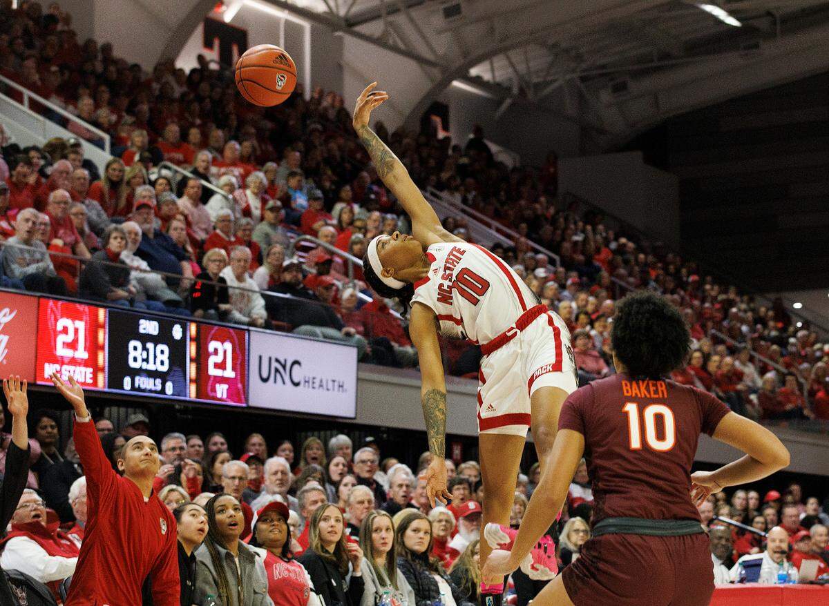 N.C. State’s Aziaha James attempts to avoid a turnover during the first half of the Wolfpack’s game against Virginia Tech on Thursday, Feb. 8, 2024, at Reynolds Coliseum in Raleigh, N.C.