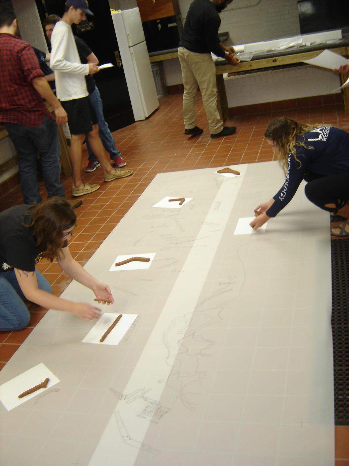 Students record timbers on the site of an unidentified shipwreck site in Bermuda.