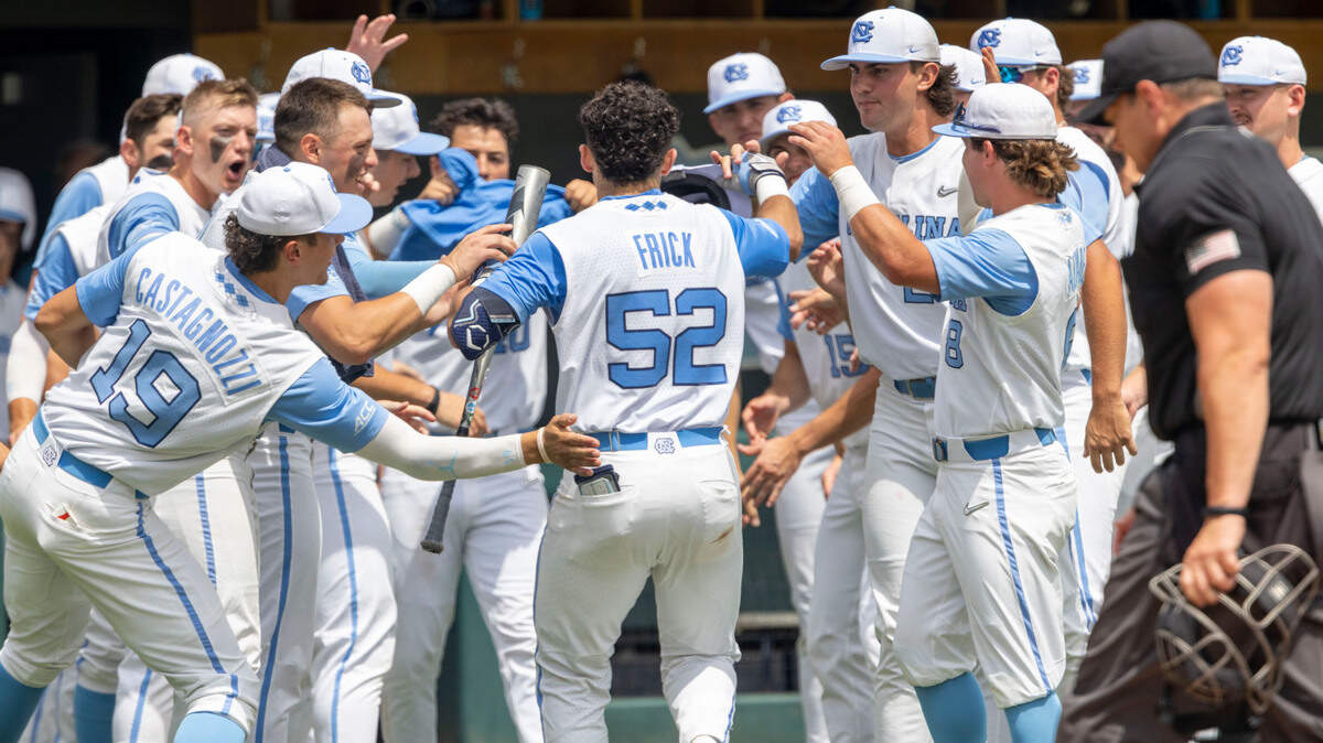 North Carolina catcher Tomas Frick (52) is greeted by teammates after a solo home run in the second inning against Hofstra on Friday, June 3, 2022 during the NCAA Regional at Boshamer Stadium in Chapel Hill, N.C.