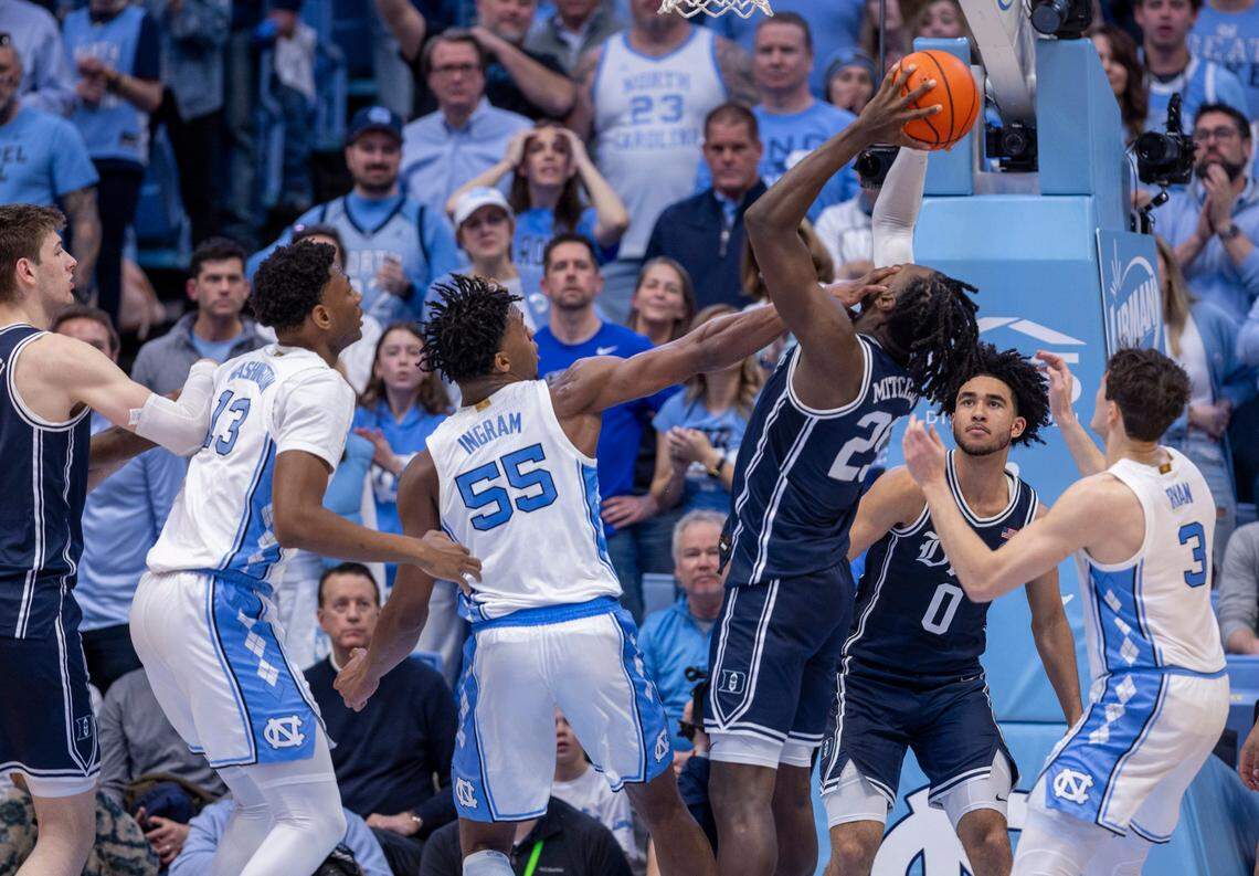 North Carolina’s Harrison Ingram (55) fouls Duke’s Mark Mitchell (25) in the second half on Saturday, February, 3, 2024 at the Dean E. Smith Center in Chapel Hill, N.C.